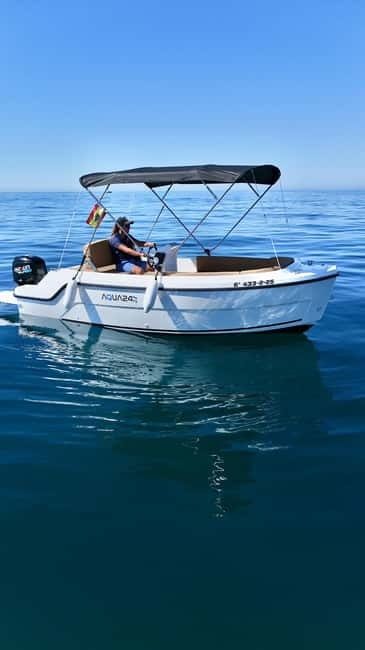 Benalmádena: license-Free Rent Boat for Dolphin Watching - Taking the helm at Puerto Marina