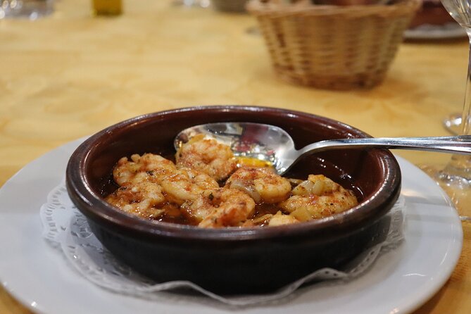 Malaga Wine & Tapas Small Group Guided Tour - Ham and vermouth at a traditional ultramarinos