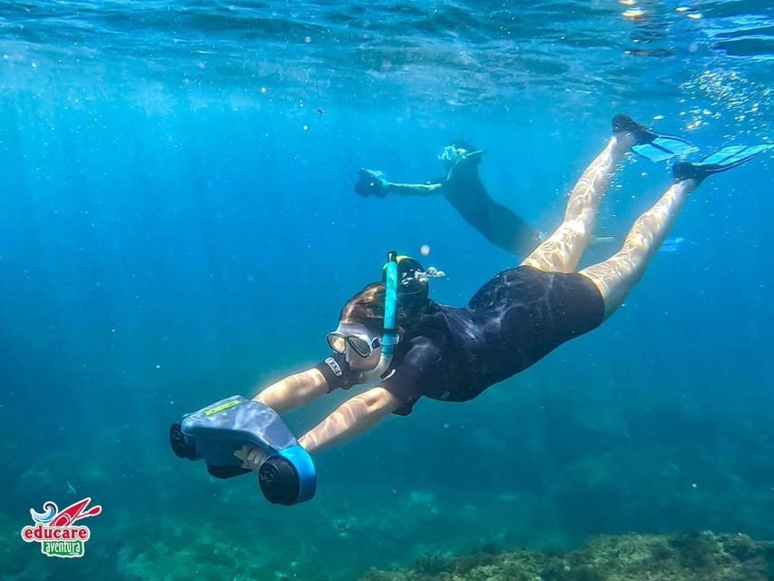 Nerja-Maro: Snorkeling & Sea Scooter Speedboat Trip - Taking a turn on the sea scooter